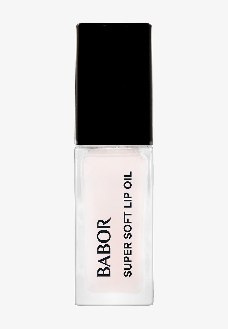 Genomskinlig glasflaska med svart kork; innehåller ljusrosa läppolja, märkt "BABOR SUPER SOFT LIP OIL" i fet svart text.