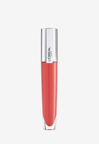 L'Oréal vloeibare lippenstift in een glanzende, koraalkleur met een doorzichtige ondersectie en een metallic zilveren dop, voorzien van een mer logo.
