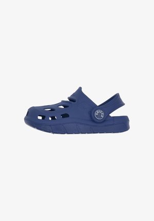 Blue plastic clogs with ventilation holes, back strap, and rounded toe. Textured surface with logo detail on the side. Lightweight design.