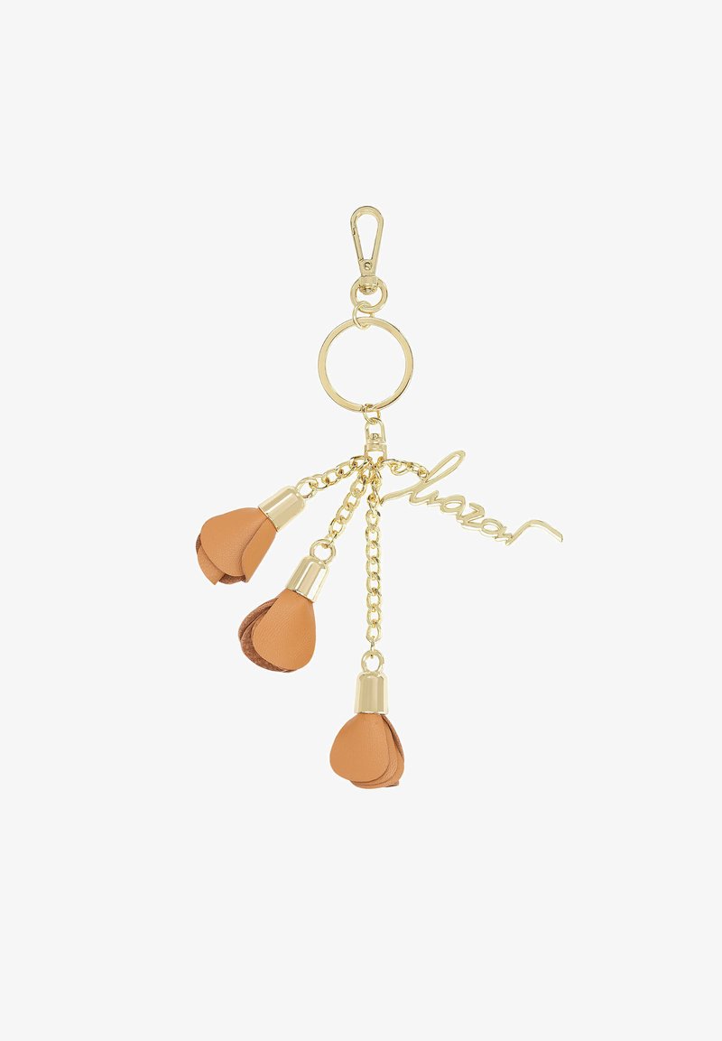 Porte-clés doré avec trois boutons de fleur en cuir beige et un charm "chanel" en cursive doré suspendu à des chaînes.