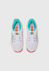 White athletic shoes with turquoise, red, and yellow accents. Mesh upper, cushioned sole, and lace-up closure. Notable logo and textured details.