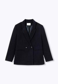 Blazer noir à double boutonnage en tissu texturé, présentant des revers crantés, deux poches avant et de gros boutons.