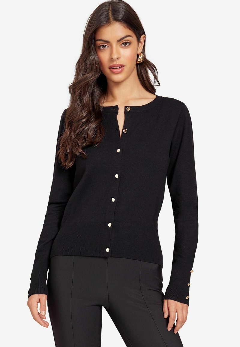 Svart knappliknande cardigan med långa ärmar, rund halslinning och guldfärgade knappdetaljer längs placket och ärmsluten. Slät textur.