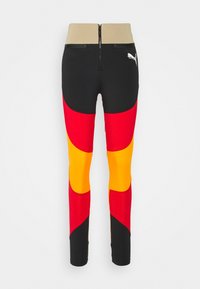 Leggings deportivos de cintura alta con una mezcla de paneles en negro, rojo, amarillo y naranja. Las características clave incluyen una cinturilla con cremallera y una tela texturizada.
