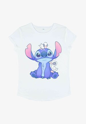 T-shirt bianco con un personaggio dei cartoni animati con grandi orecchie viola, corpo blu e due uccelli bianchi sulla testa, su uno sfondo pulito.