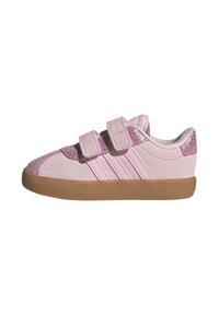 Roze antilop papuče s glitter naglascima, dva čičak remena i smešnim gumiranim đonom. Ima tri ružičaste pruge sa strane.