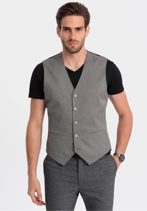 Gray houndstooth vest with five buttons, paired with a black t-shirt. Features a tailored fit and two front pockets.