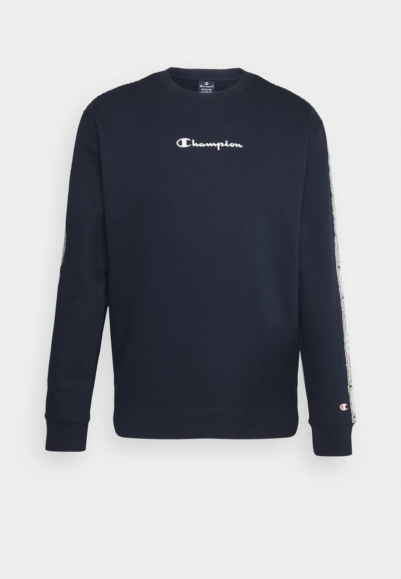 Sweat-shirt Champion bleu marine foncé avec logo blanc sur la poitrine et bandes de marque sur les deux manches, poignets et ourlet côtelés.
