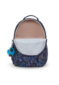 Zaino con vano principale aperto, blu navy con motivi di creature marine neon, e un piccolo portachiavi a forma di scimmietta blu attaccato al lato.
