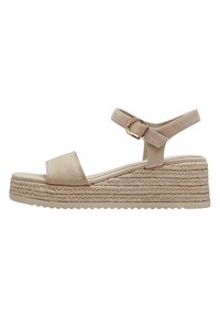 Beige espadrille wedge sandals with a suede upper, adjustable strap, and woven jute sole. Features a flat platform and textured outsole.