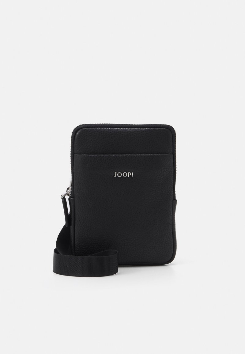 Black leather crossbody bag with textured surface, zip closure, and a detachable fabric strap. Features a silver logo on the front.