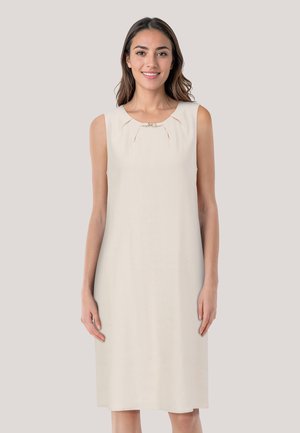 Cream-colored sleeveless dress with a round neckline, subtle pleating, and a decorative accent at the center of the chest. Smooth texture.