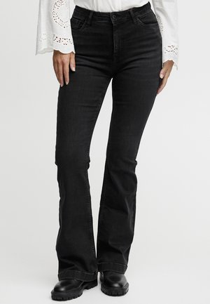 Jean noir évasé en denim, avec une taille haute, un design à cinq poches et un léger dégradé. La texture est lisse avec un léger extensibilité.