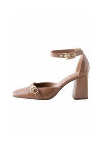 Brown patent leather high-heel shoe with a square toe, ankle strap, and gold buckle detail. Features a chunky heel and smooth texture.
