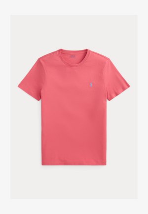 Korall színű pamut póló, rövid ujjú, kerek nyakkivágással, mellrészen kis kék logóval, sima tapintású.