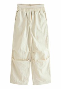 Beige, brede bukser med elastisk talje, der har to sidelommer og et tekstureret, krøllet stofudseende.