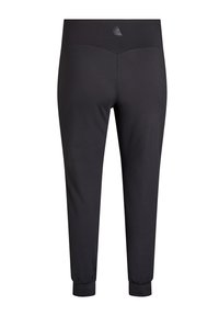 Schwarze Sportleggings aus weichem, dehnbarem Material mit hohem Bund und eng anliegenden Bündchen, mit einem dezenten Logo auf der Rückseite.