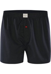 Černé trenýrky s bílými puntíky, elastický pas a jeden detail červeného knoflíku. Štítek zní "Pili & Co. Berlín." Hladká textura látky.