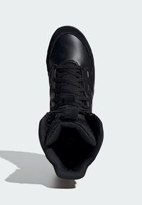 Black high-top shoe with a smooth leather upper, fabric lining, textured sole, and traditional lace closure. Features a padded collar.