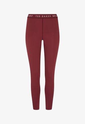 Bordó leggings rugalmas anyagból, széles derékpánttal, amelyen a "TED BAKER SPORT" felirat látható. Simább textúra, kúpos kialakítás.