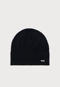 Black knit beanie with a folded brim. Features a subtle white embroidered logo. Soft texture and fitted shape, suitable for cold weather.