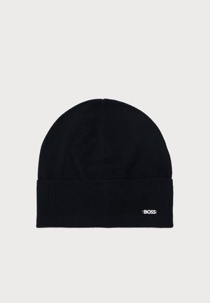 Black knit beanie with a folded brim. Features a subtle white embroidered logo. Soft texture and fitted shape, suitable for cold weather.