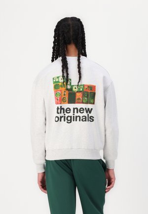 Gray sweatshirt with a back graphic of colorful speaker designs and text "the new originals." Fits relaxed with ribbed cuffs and hem.