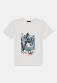 Weißes Baumwoll-T-Shirt mit einem grafischen Druck des Gesichts eines Jaguars in Blau und Schwarz mit roten Akzenten sowie dem Text "IKKS Tropical Exploration."