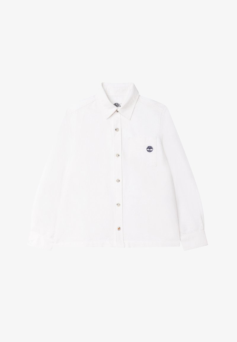 Chemise blanche à manches longues en tissu léger. Dotée d'un boutonnage sur le devant, d'une poche poitrine unique et d'un petit logo sur la poche.