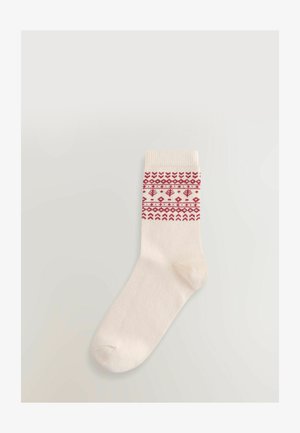 Krämfärgad strumpa med ett mönstrat röd band nära toppen som har geometriska former och linjer; mjuk textur, standard ankellängd.