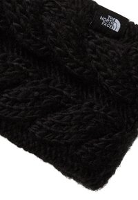 Črna pletena trak za glavo iz debele preje z teksturiranim vzorcem. V kotu majhna vezeno etiketa.