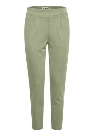 Zelené pletené kalhoty s hladkou texturou, elastickým pasem, slim fit a dvěma předními plizé. Žádné viditelné kapsy ani hardwarové detaily.