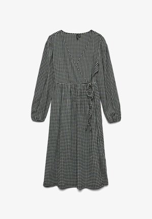 Mustvalge ruuduline kleit pika varrukaga, V-kaelus, rõhutatud vöökoht ja sidumisdetail. Kerge kangas voolava disainiga.