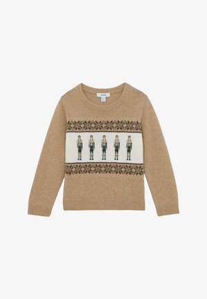 Pull en maille beige avec cinq figurines de casse-noisette dans des bandes à motifs vert foncé et marron sur la poitrine et les poignets.