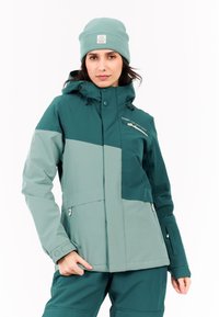 Türkisfarbene und hellgrüne Skijacke mit Kapuze, Reißverschlusstaschen und schlanker Passform. Hat eine strukturierte Außenseite und verstellbare Bündchen.