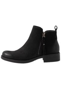 Stivaletti neri realizzati in materiale scamosciato, con punta rotonda, zip laterale e un accento decorativo con nappina vicino alla zip. Tacco basso.