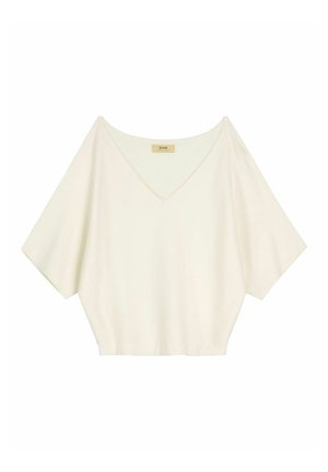 Biały, luźny top z krótkim rękawem, szerokim dekoltem w kształcie litery V i lekko skróconym dołem, pokazany na płasko na białym tle.