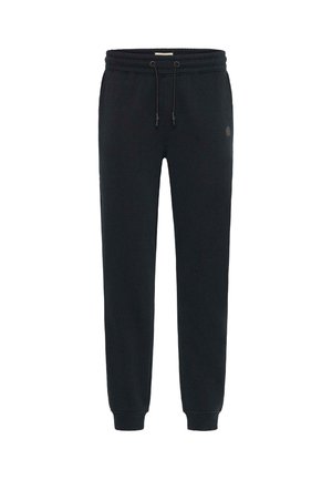 Pantaloni sportivi neri realizzati in morbido tessuto con vita elasticizzata, dettagli con cordino, tasche laterali e un logo sul lato sinistro.