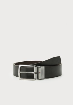 Black leather belt with a silver rectangular buckle. Features a smooth texture and a dual-tone design. Additionally, has a small logo accent.