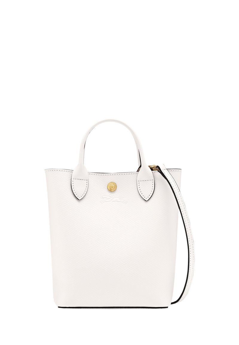 White leather tote bag with rounded handles, gold hardware, and a detachable strap. Features textured grain and black edging. Simple design.