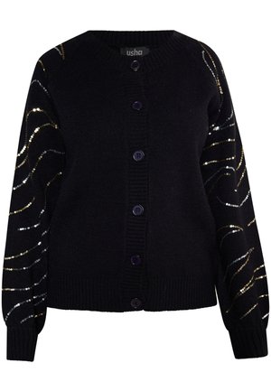 Crna kardigan s ljubičastim gumbima, dugih rukava ukrašenih valovitim uzorcima od zlatnih i srebrnih šljokica. Mekana pletenina s teksturom.
