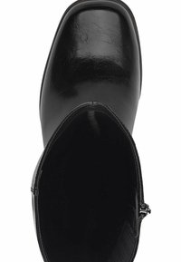 Top view of a black leather ankle boot with a rounded square toe and side zipper opening on a white background.