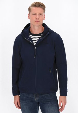 Jachetă cu fermoar de culoare bleumarin, cu glugă, având o buzunar frontal și un strat cu model în dungi dedesubt. Material neted cu un design ajustat.