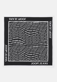 Black and white scarf featuring repeated text design "JOOP! JEANS" on a soft fabric, with a solid border and smooth texture.