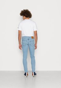 Levi's® 512™ SLIM TAPER - Calças de ganga justas - corfu lucky day