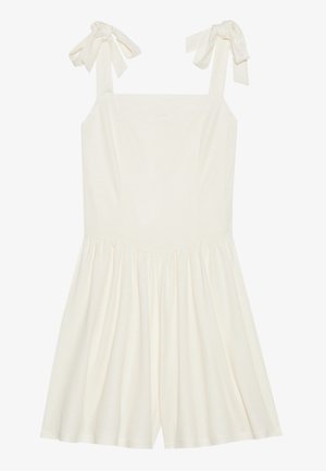 Bela romperska obleka z nastavljivimi trakovi v obliki mašne, prilegajočim bodijem in širokim krilom iz mehke teksturirane tkanine za udobje.