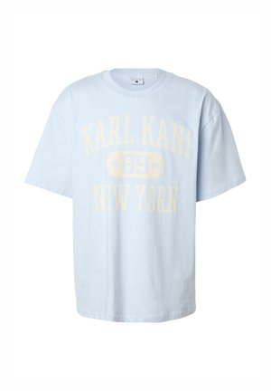 T-shirt a maniche corte di colore azzurro chiaro con vestibilità oversize, con testo sbiadito giallo "KARL KANI 89 NEW YORK" sul davanti.