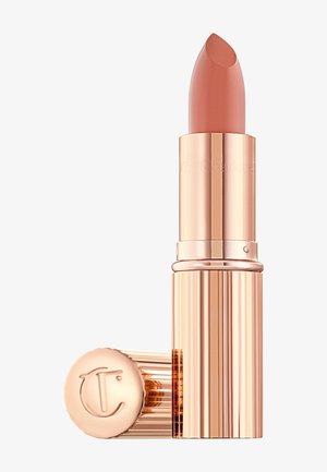 Nude-tone lipstick with a shiny rose gold case, cap removed and resting against the base, showing engraved logo on the cap.