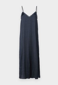 Navy sleeveless nightgown with white and red polka dots, scalloped neckline, and a long, flowing design made of soft fabric.
