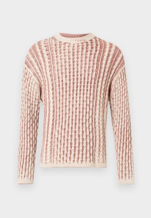 Strikket trøje med tekstur i bløde nuancer af pink og creme, med ribbet mønster, rund halsudskæring og lange ærmer.